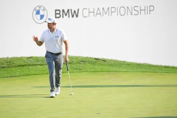 Patrick Cantlay waves after making a putt on the 15th green during the first round of the BMW Championship at Caves Valley Golf Club on August 26,...