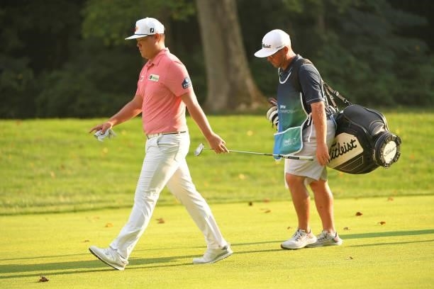 Sungjae Im of South Korea and his caddie walk along the 15th fairway during the first round of the BMW Championship at Caves Valley Golf Club on...