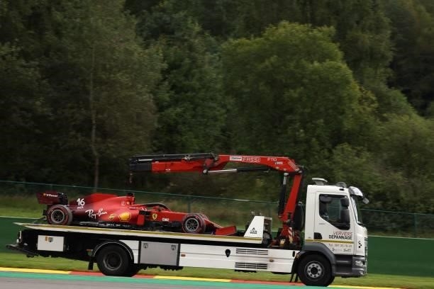 Crane truck transports the car of Ferrari's Monegasque driver Charles Leclerc after he crashed during the second practice session of the Formula One...