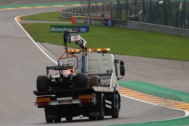 Crane truck transports the car of Red Bull's Dutch driver Max Verstappen after he crashed during the second practice session of the Formula One...