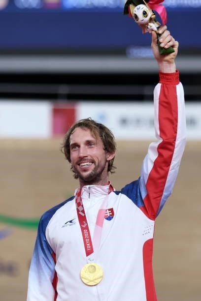 Gold medalist Jozef Metelka of Team Slovakia celebrates on the podium during the medal ceremony for the Track Cycling Men's C4 4000m Individual...