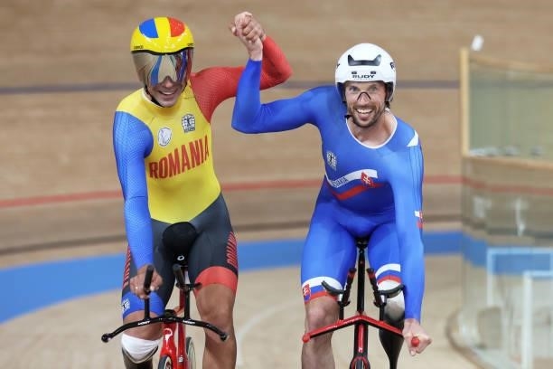 Gold medalist Jozef Metelka of Team Slovakia and silver medalist Carol-Eduard Novak of Team Romania celebrate after the Track Cycling Men's C4 4000m...