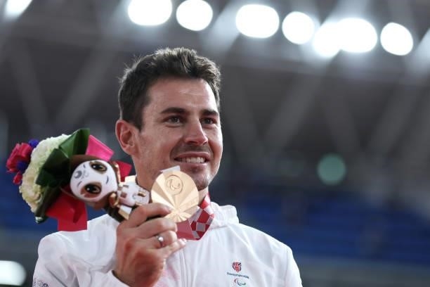 Bronze medalist Jaco van Gass of Team Great Britain celebrates during the medal ceremony for the Track Cycling Men's C1-2-3 1000m Time Trial on day 3...
