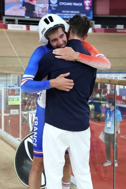 Dorian Foulon of Team France celebrates with Alexandre Leaute of Team France after winning the gold medal after the Track Cycling Men's C5 4000m...
