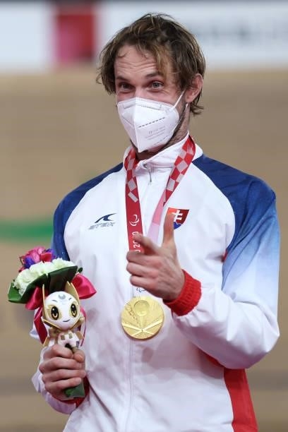 Gold medalist Jozef Metelka of Team Slovakia celebrates on the podium during the medal ceremony for the Track Cycling Men's C4 4000m Individual...