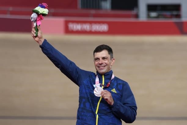 Silver medalist Carol-Eduard Novak of Team Romania celebrates on the podium during the medal ceremony for the Track Cycling Men's C4 4000m Individual...