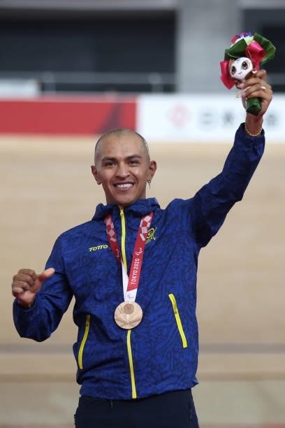 Bronze medalist Diego German Duenas of Team Colombia celebrates on the podium during the medal ceremony for the Track Cycling Men's C4 4000m...