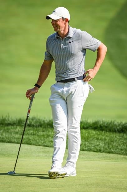 Rory McIlroy of Northern Ireland smiles on the ninth hole green during the first round of the BMW Championship, the second event of the FedExCup...