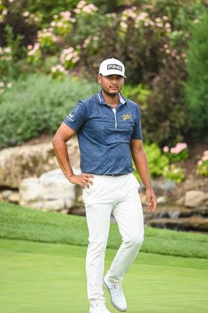 Sebastian Munoz of Colombia walks off the 18th hole green during the first round of the BMW Championship, the second event of the FedExCup Playoffs,...