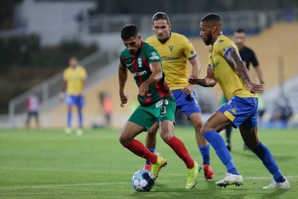 Ali Alipour forward of CS Maritimo battle for the ball during the Liga Portugal Bwin match between GD Estoril de Praia and CS Maritimo at Estádio...