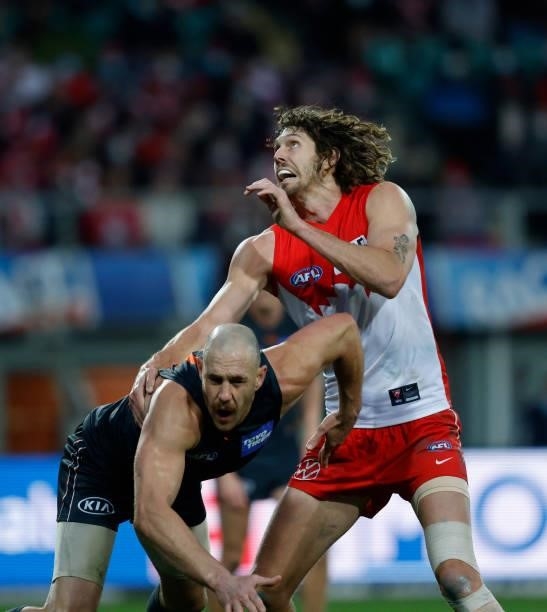 Shane Mumford of the Giants and Tom Hickey of the Swans fight for position during the 2021 AFL Second Elimination Final match between the Sydney...