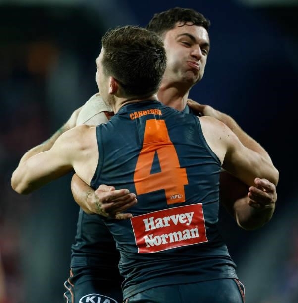 Toby Greene and Tim Taranto of the Giants celebrate their win during the 2021 AFL Second Elimination Final match between the Sydney Swans and the GWS...