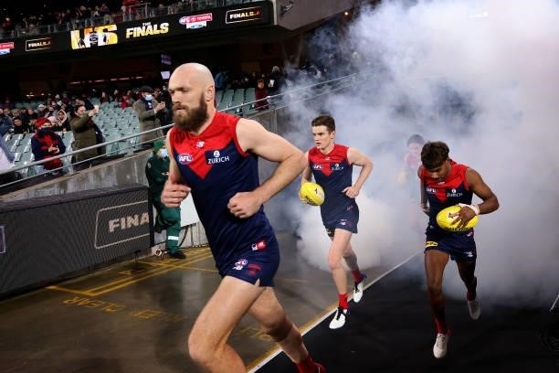 Max Gawn of the Demons leads his team out during the 2021 AFL First Qualifying Final match between the Melbourne Demons and the Brisbane Lions at...