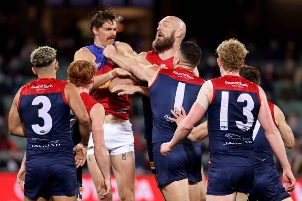 Joe Daniher of the Lions clashes with Max Gawn of the Demons during the 2021 AFL First Qualifying Final match between the Melbourne Demons and the...