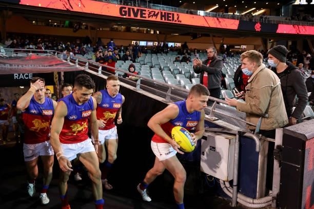 The Lions run out during the 2021 AFL First Qualifying Final match between the Melbourne Demons and the Brisbane Lions at Adelaide Oval on August 28,...