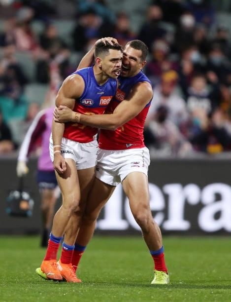 Charlie Cameron of the Lions celebrates a goal with Nakia Cockatoo during the 2021 AFL First Qualifying Final match between the Melbourne Demons and...