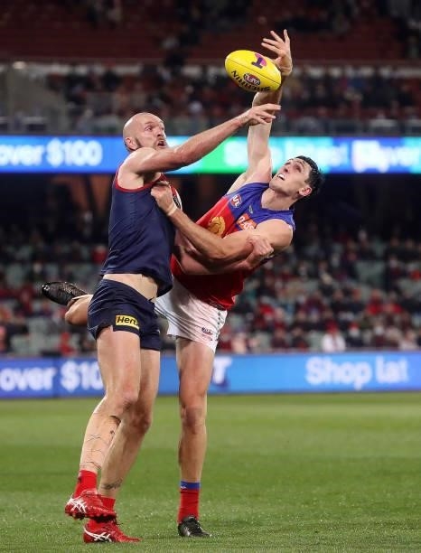 Max Gawn of the Demons and Oscar McInerney of the Lions during the 2021 AFL First Qualifying Final match between the Melbourne Demons and the...