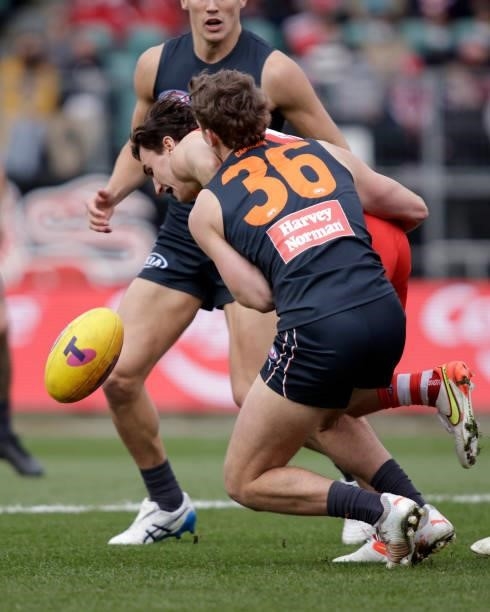 Sam Wicks of the Swans is tackled by Harry Perryman of the Giants during the 2021 AFL Second Elimination Final match between the Sydney Swans and the...