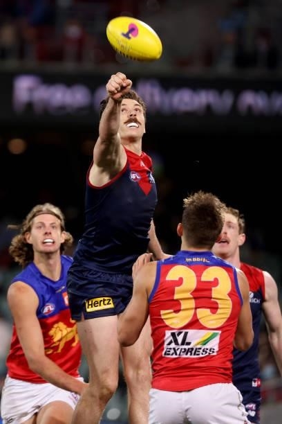 Jake Lever of the Demons punches the ball during the 2021 AFL First Qualifying Final match between the Melbourne Demons and the Brisbane Lions at...