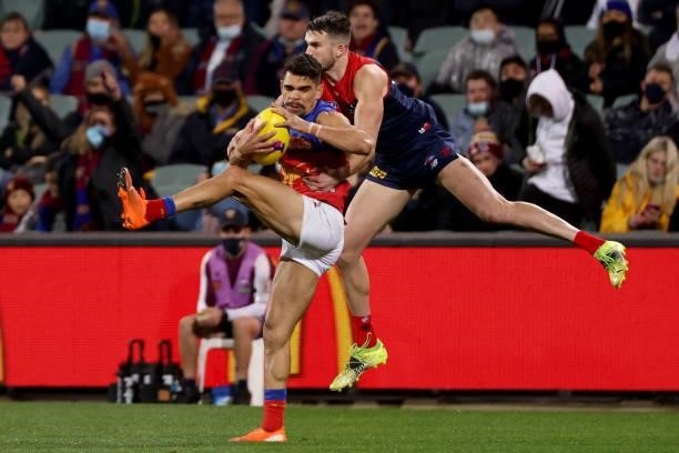 Charlie Cameron of the Lions out marks Joel Smith of the Demons during the 2021 AFL First Qualifying Final match between the Melbourne Demons and the...