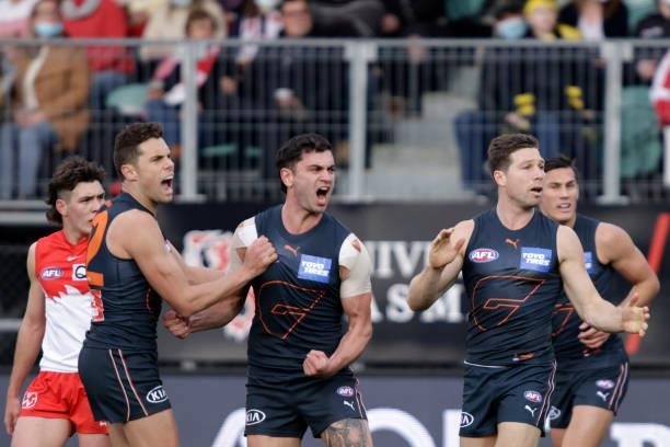 Tim Taranto of the Giants and Kieren Briggs of the Giants celebrates a goal during the 2021 AFL Second Elimination Final match between the Sydney...