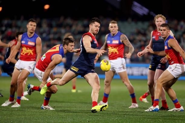 Jarryd Lyons of the Lions tackles Alex Neal-Bullen of the Demons during the 2021 AFL First Qualifying Final match between the Melbourne Demons and...