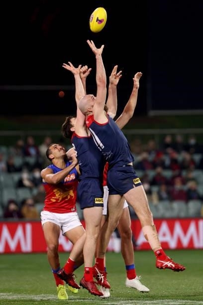 Max Gawn of the Demons reaches for the ball during the 2021 AFL First Qualifying Final match between the Melbourne Demons and the Brisbane Lions at...