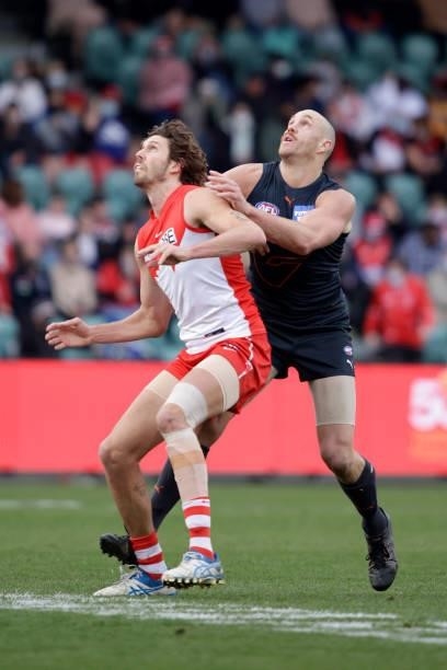 Tom Hickey of the Swans and Shane Mumford of the Giants compete for the ball during the 2021 AFL Second Elimination Final match between the Sydney...