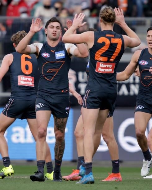 Tim Taranto of the Giants and Harry Himmelberg of the Giants celebrates a goal during the 2021 AFL Second Elimination Final match between the Sydney...