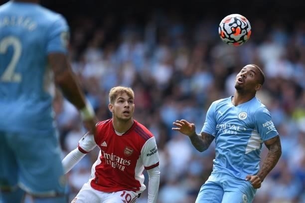Arsenal's English midfielder Emile Smith Rowe vies with Manchester City's Brazilian striker Gabriel Jesus during the English Premier League football...