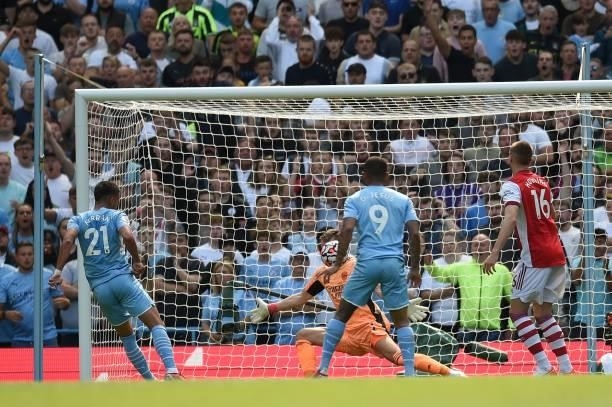Manchester City's Spanish midfielder Ferran Torres scores his team's opening goal during the English Premier League football match between Manchester...