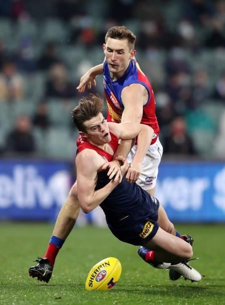 Bayley Fritsch of the Demons and Harris Andrews of the Lions during the 2021 AFL First Qualifying Final match between the Melbourne Demons and the...