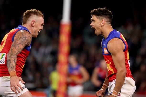 Mitch Robinson and Charlie Cameron of the Lions celebrate a goal during the 2021 AFL First Qualifying Final match between the Melbourne Demons and...