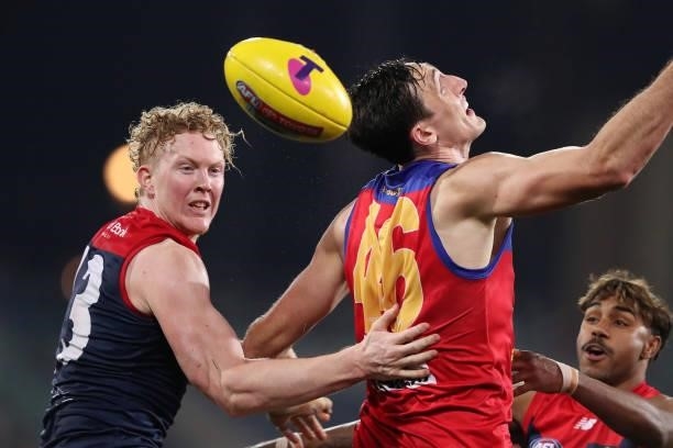Clayton Oliver of the Demons and Oscar McInerney of the Lions during the 2021 AFL First Qualifying Final match between the Melbourne Demons and the...