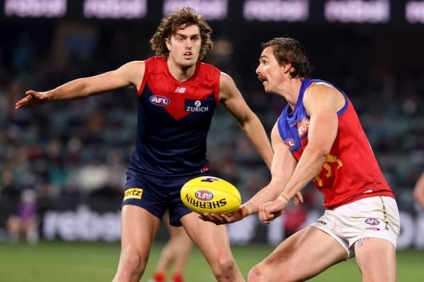 Luke Jackson of the Demons tackles Joe Daniher of the Lions during the 2021 AFL First Qualifying Final match between the Melbourne Demons and the...