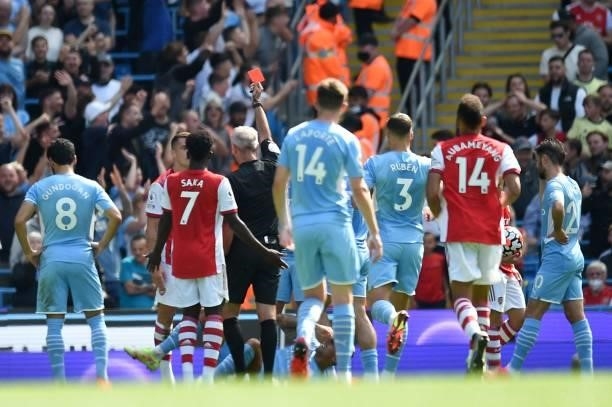 Arsenal's Swiss midfielder Granit Xhaka is shown the red card during the English Premier League football match between Manchester City and Arsenal at...