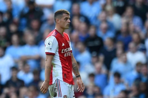 Arsenal's Swiss midfielder Granit Xhaka walks off after being shown the red card during the English Premier League football match between Manchester...