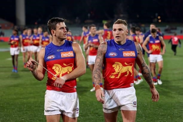 Jarryd Lyons and Mitch Robinson of the Lions after their loss during the 2021 AFL First Qualifying Final match between the Melbourne Demons and the...