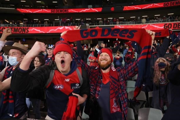 Demons fans celebrate their win during the 2021 AFL First Qualifying Final match between the Melbourne Demons and the Brisbane Lions at Adelaide Oval...