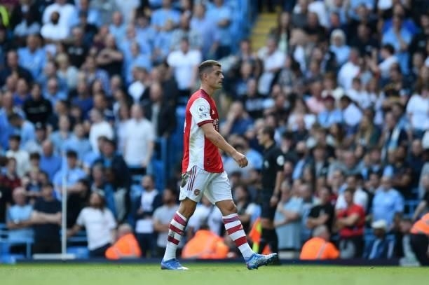 Arsenal's Swiss midfielder Granit Xhaka walks off having been shown the red card during the English Premier League football match between Manchester...