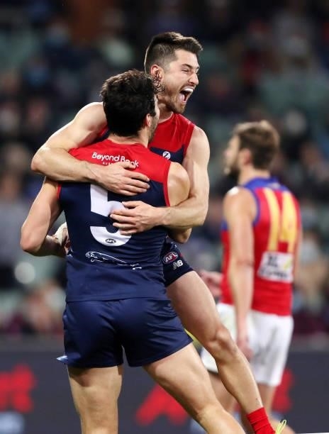 Christian Petracca of the Demons celebrates a goal Alex Neal-Bullen during the 2021 AFL First Qualifying Final match between the Melbourne Demons and...