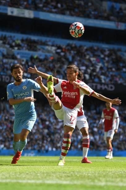 Arsenal's German-born Portuguese defender Cedric Soares vies with Manchester City's Portuguese midfielder Bernardo Silva during the English Premier...