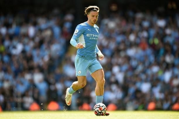 Manchester City's English midfielder Jack Grealish controls the ball during the English Premier League football match between Manchester City and...