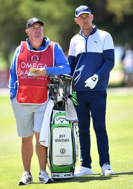 Jeff Winter of Denmark looks on at the 18th hole with his caddie during Day Three of The Omega European Masters at Crans-sur-Sierre Golf Club on...
