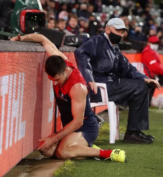Alex Neal-Bullen of the Demons slams into the LED fence during the 2021 AFL First Qualifying Final match between the Melbourne Demons and the...