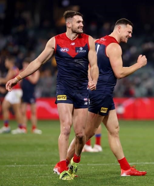 Joel Smith and Steven May of the Demons celebrate their win during the 2021 AFL First Qualifying Final match between the Melbourne Demons and the...