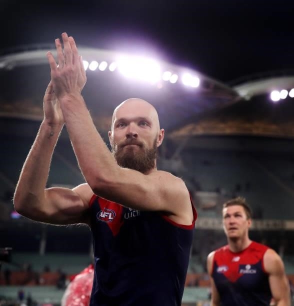 Max Gawn of the Demons applauds the crowd as he leads his team off after the win during the 2021 AFL First Qualifying Final match between the...