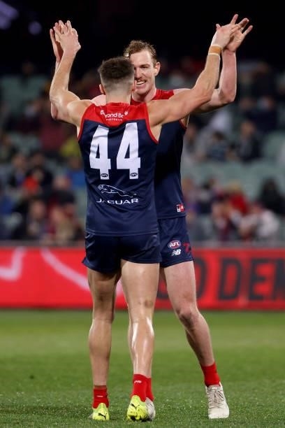 Joel Smith and Harrison Petty of the Demons celebrate their win during the 2021 AFL First Qualifying Final match between the Melbourne Demons and the...