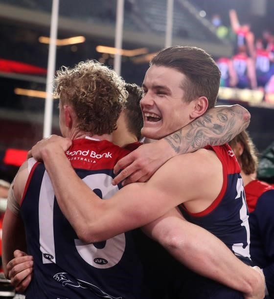 Bayley Fritsch of the Demons hugs Clayton Oliver after the win during the 2021 AFL First Qualifying Final match between the Melbourne Demons and the...
