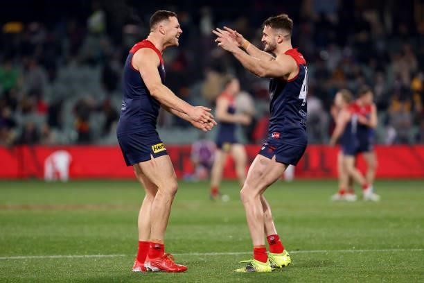 Joel Smith and Steven May of the Demons celebrate their win during the 2021 AFL First Qualifying Final match between the Melbourne Demons and the...